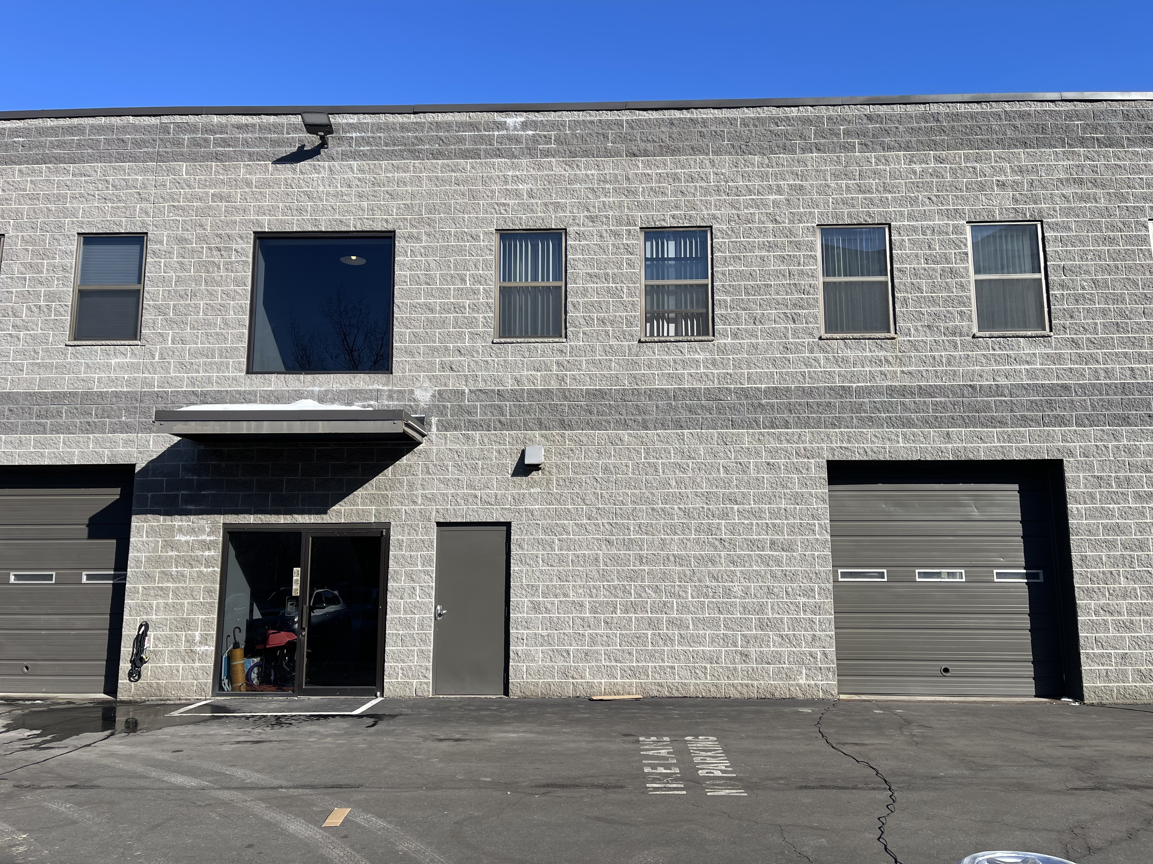 Car dealership exterior with new lights daytime