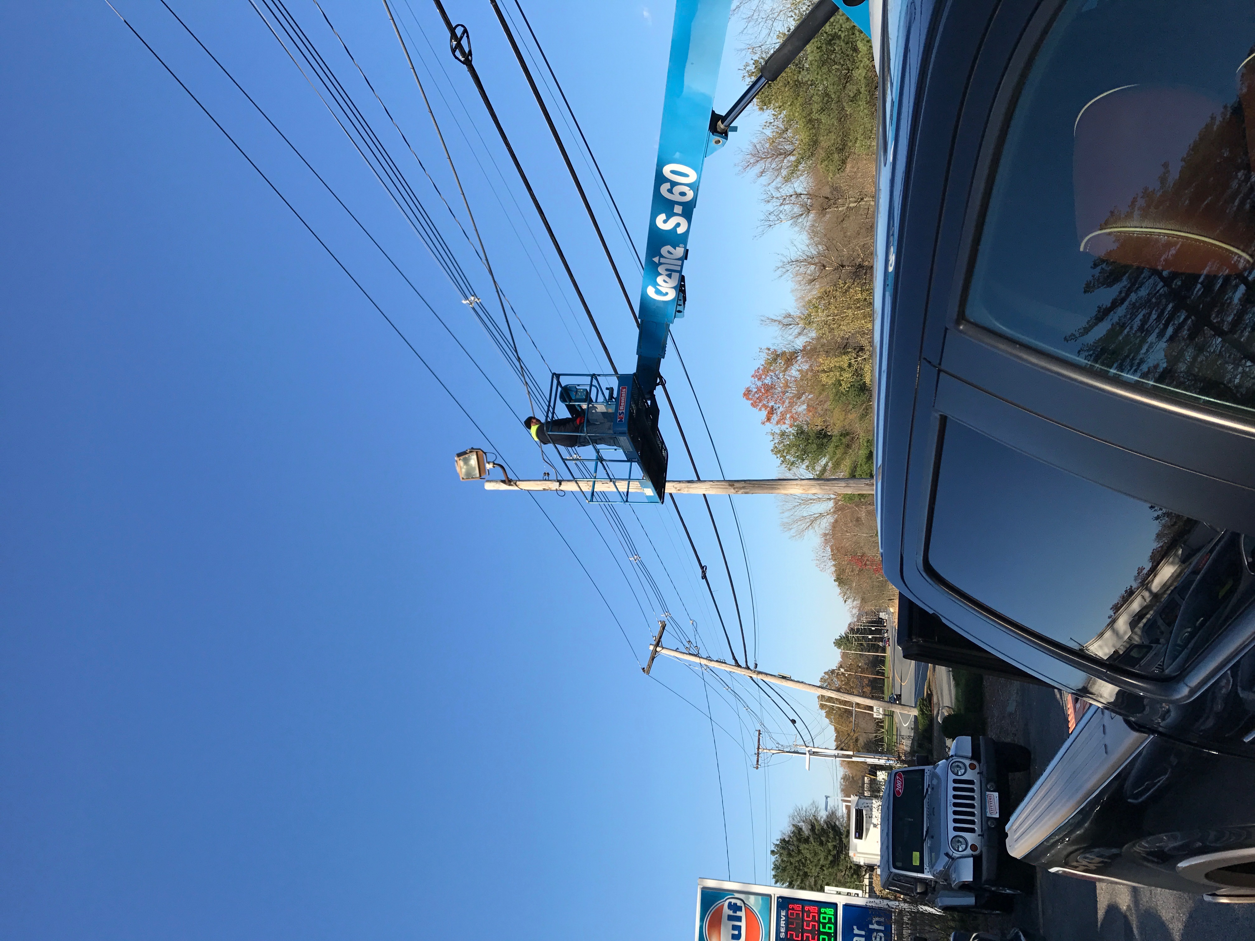 Car dealership post light installation with boom lift