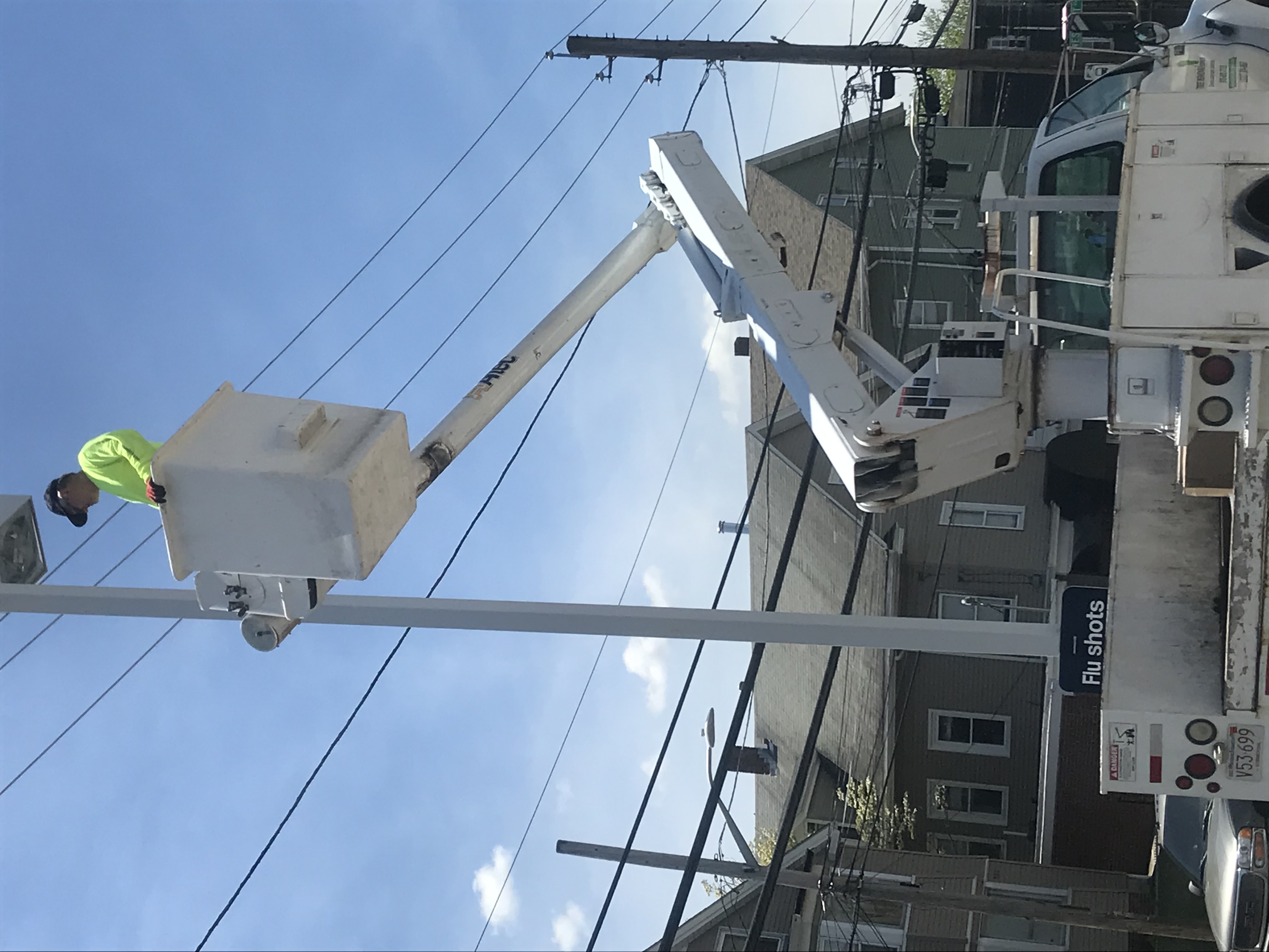 Bucket truck parking lot light service